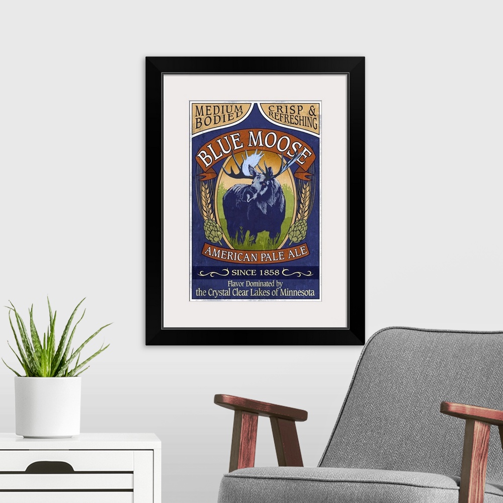 A modern room featuring Retro stylized art poster of a vintage sign using a moose to advertise ale.