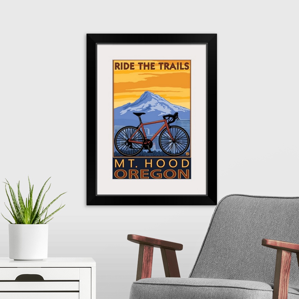 A modern room featuring Retro stylized art poster of a mountain bike, with a city skyline and mountain in the background.