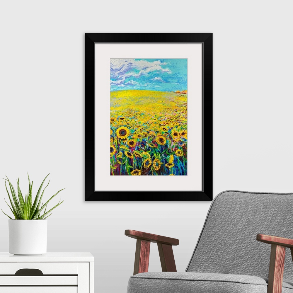 A modern room featuring Brightly colored triptych of a sunflower field. Panel 1 of 3.