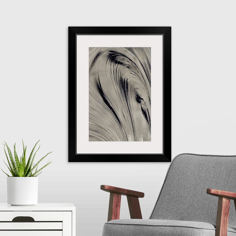 A modern room featuring Giant photograph focuses on the gentle curved movements of a thick, dark substance.