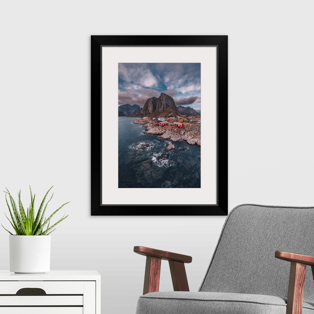 A modern room featuring One of the most iconic views of Lofoten Norway, seen from Hamny, a small fishing village in the s...