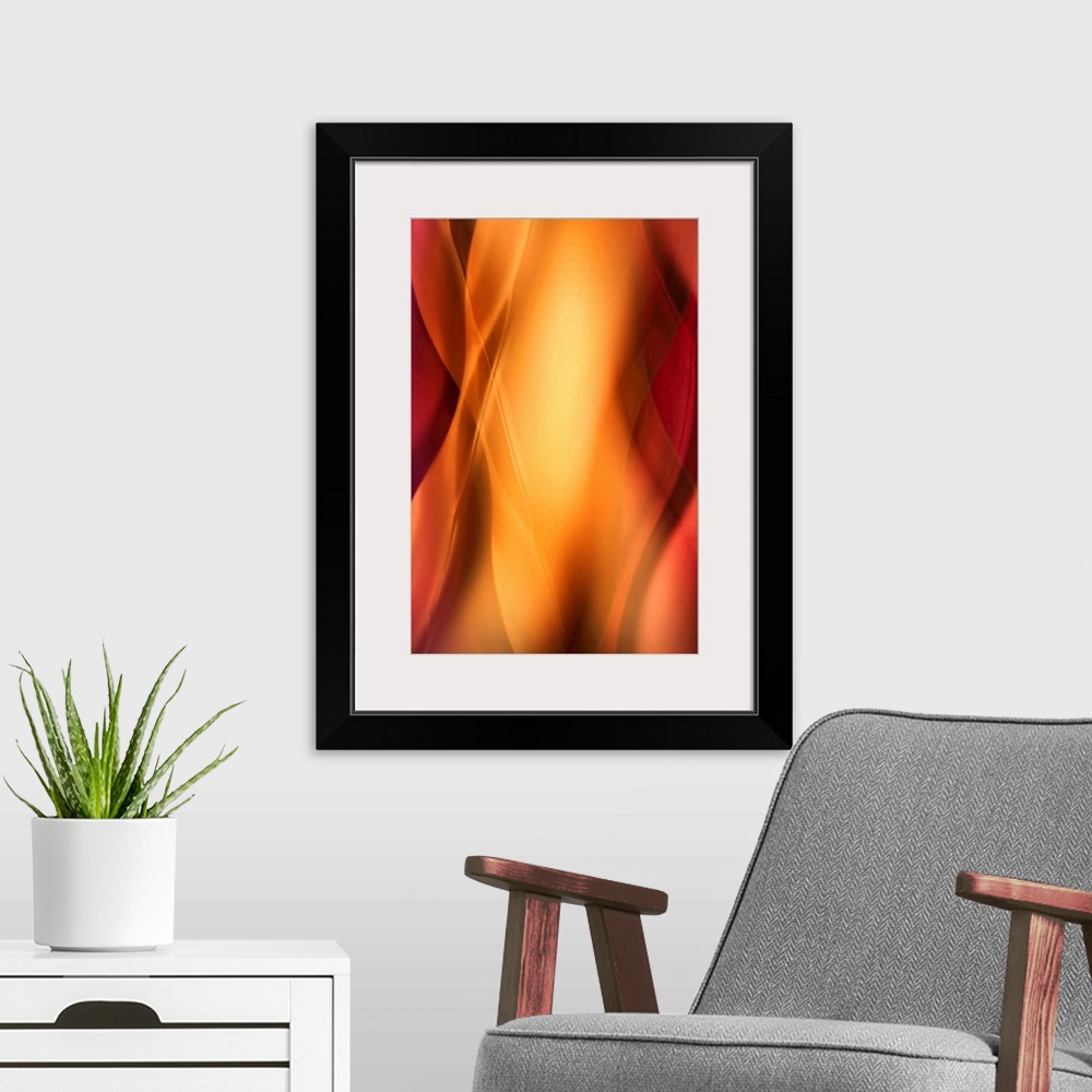 A modern room featuring Contemporary abstract photograph of blurred vertical waves and lines of light depicting the curve...