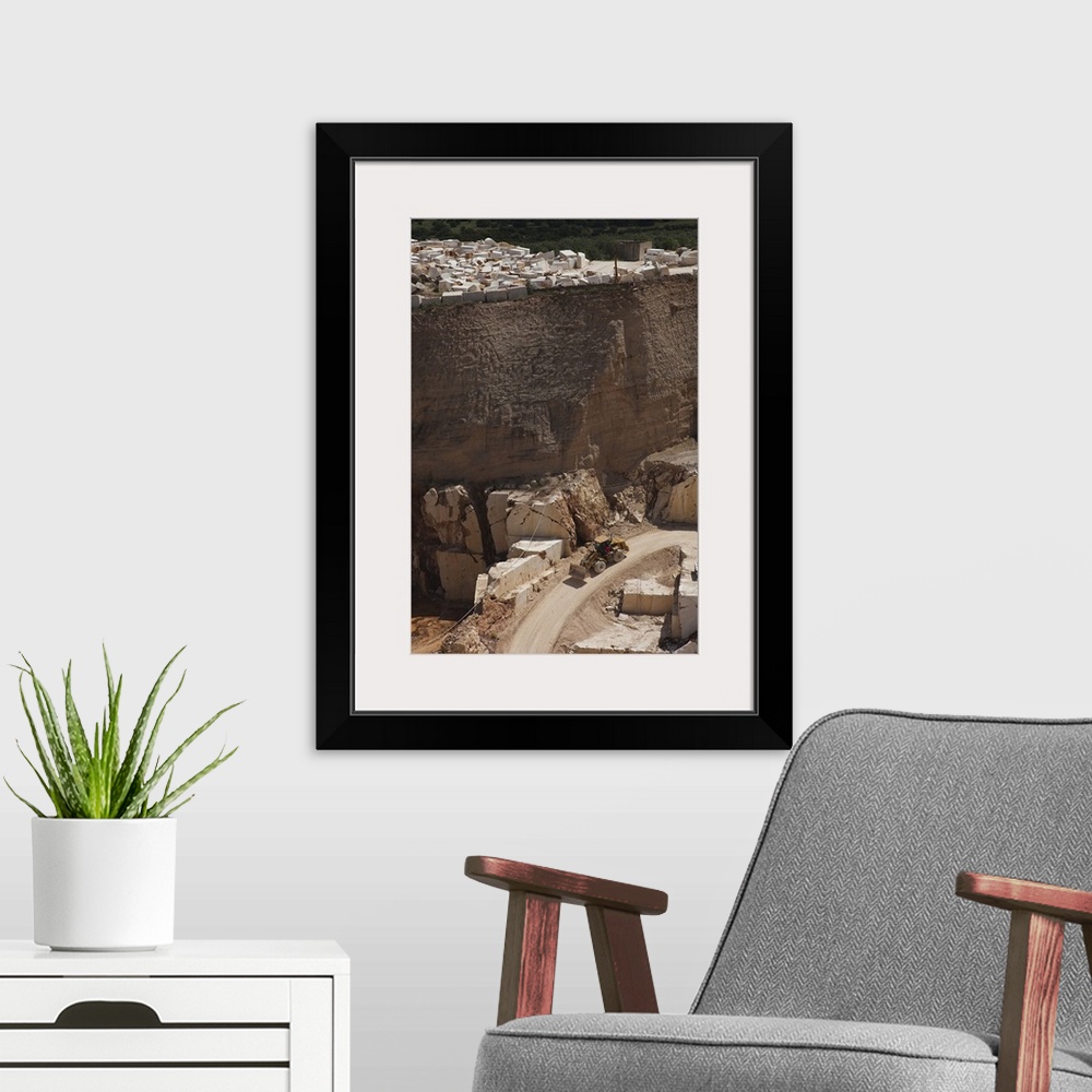 A modern room featuring Earth mover at a marble quarry, Orosei, Golfo di Orosei, Sardinia, Italy