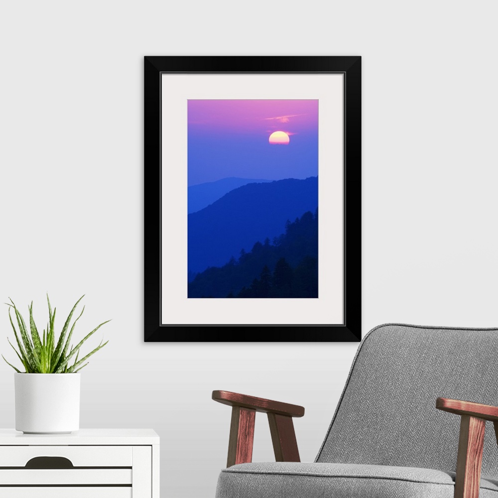 A modern room featuring Sun setting behind clouds, silhouetted mountains, Great Smoky Mountains National Park, Tennessee