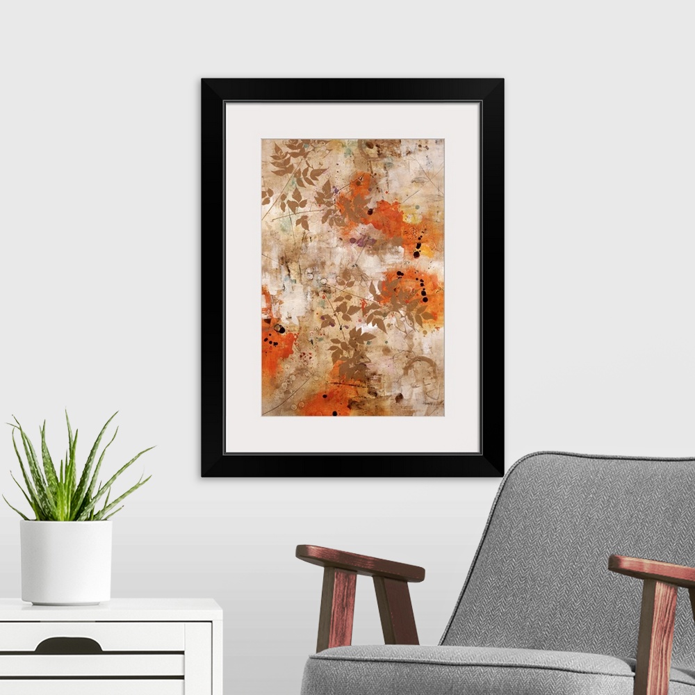 A modern room featuring Abstract artwork that has splashes of orange and small branches with leaves painted over the print.