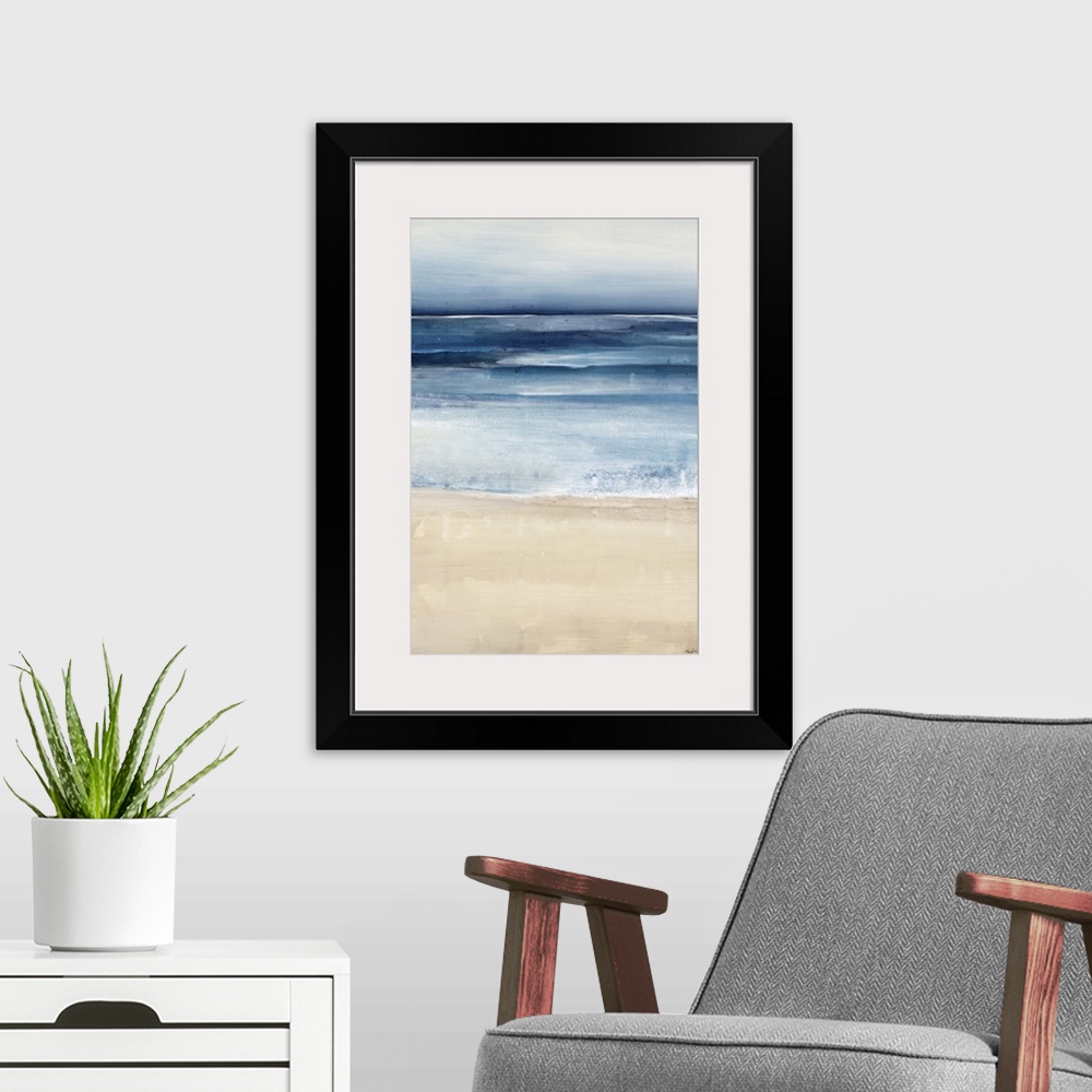 A modern room featuring Contemporary painting of a peaceful beach scene, where the ocean and sand meet.