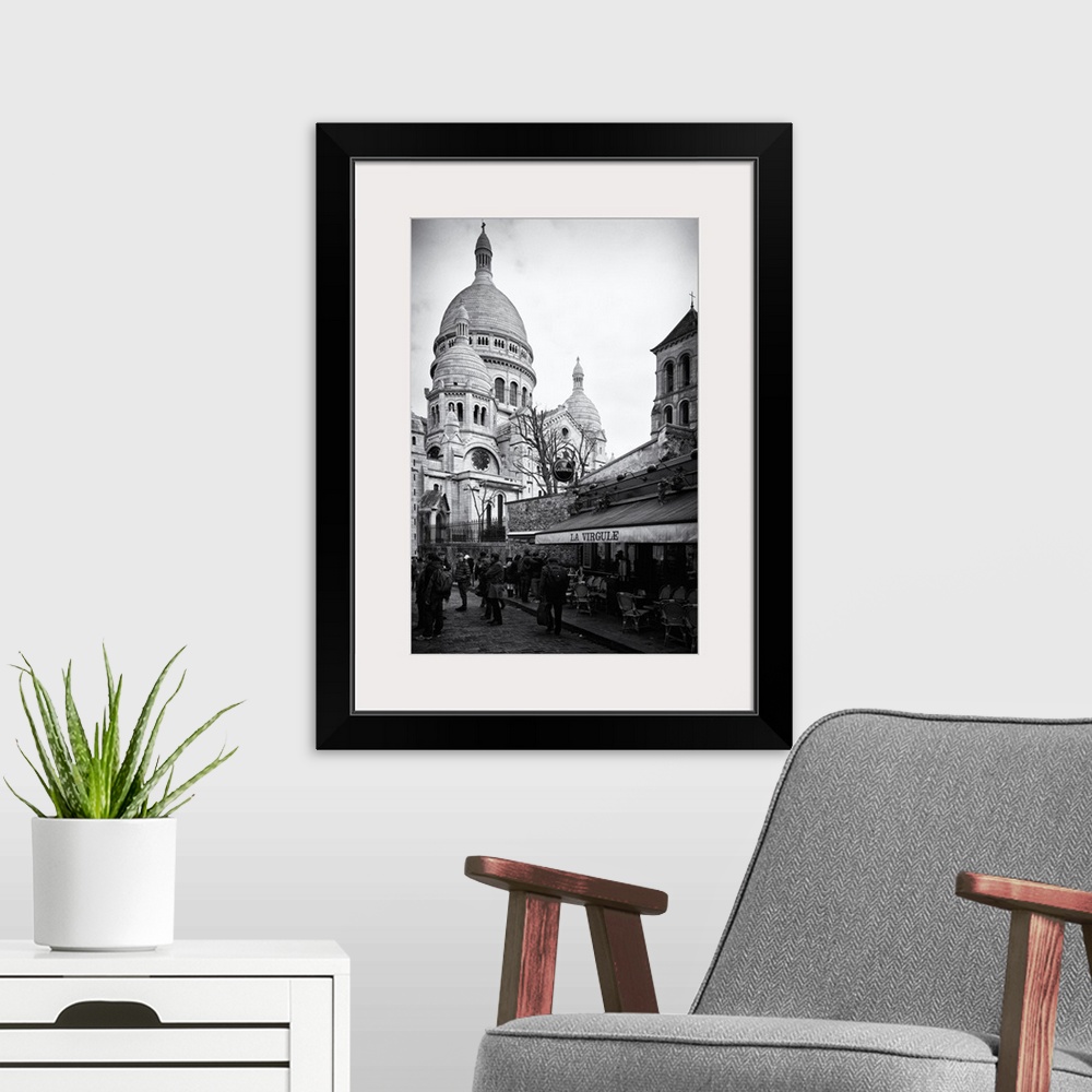 A modern room featuring Black and white photo of the Sacre Coeur Basilica, showing the dome architecture.