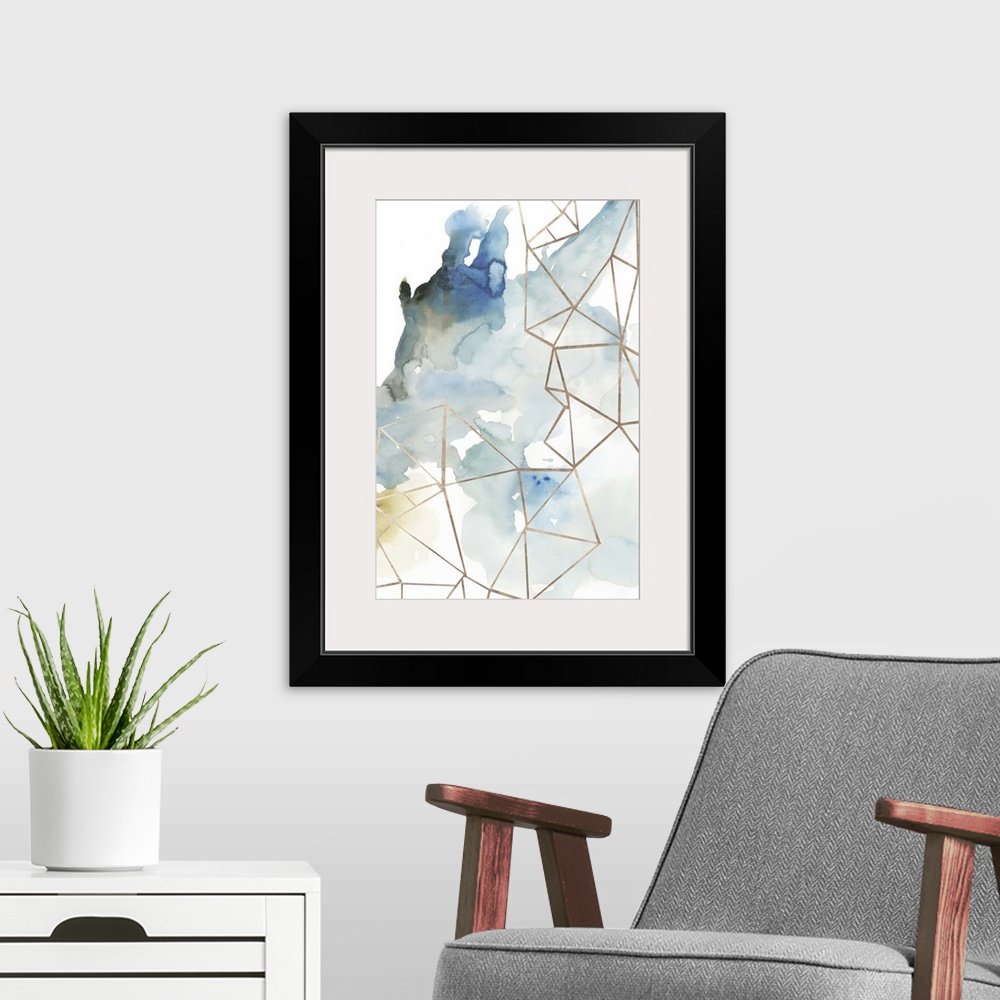 A modern room featuring Abstract watercolor painting of blue and brown with geometric gold lines.