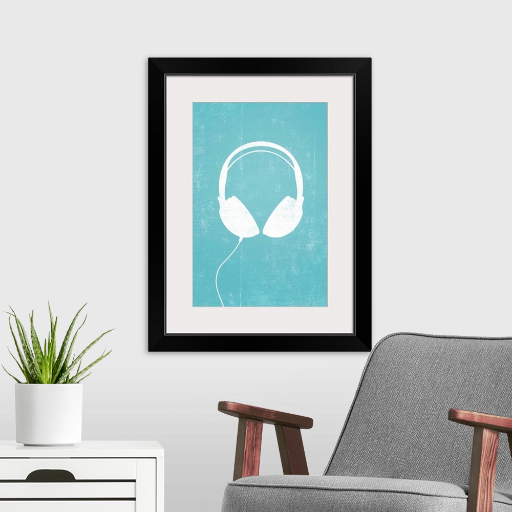 A modern room featuring Giant, vertical retro art of a white silhouette of a pair of headphones with a thin cord attached...