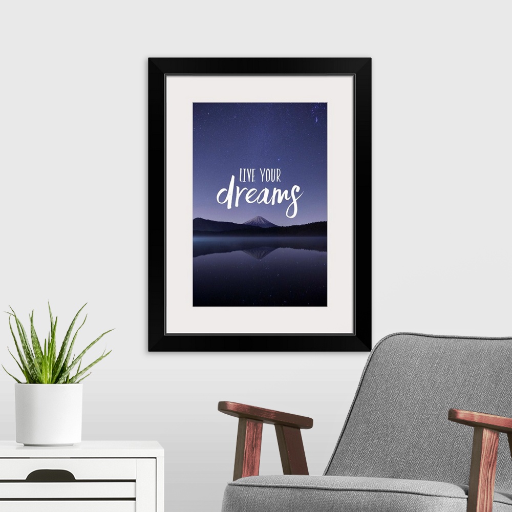 A modern room featuring Typography art against a photograph of a mountain under a night sky.