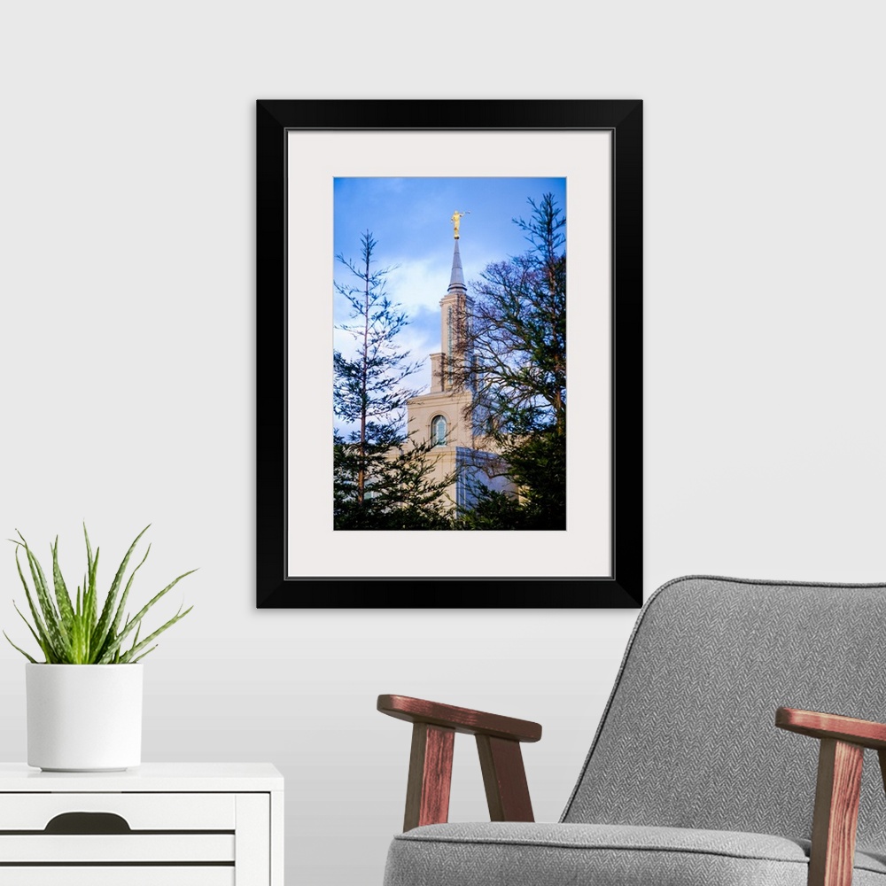 A modern room featuring The Sacramento California Temple overlooks Lake Natoma from the hill where it sits. The Sierra Ne...