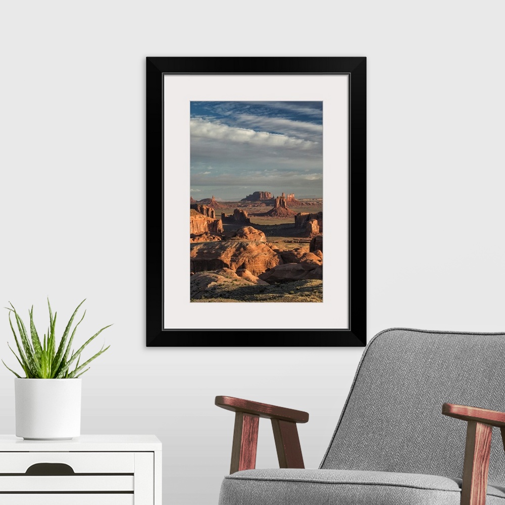 A modern room featuring Picturesque Hunts Mesa rock formation in Monument Valley, Arizona