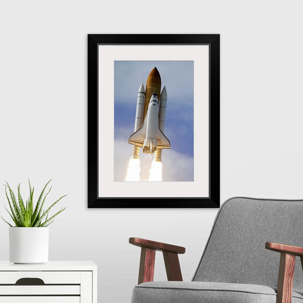 A modern room featuring Space Shuttle Atlantis lifts off from Kennedy Space Center Florida