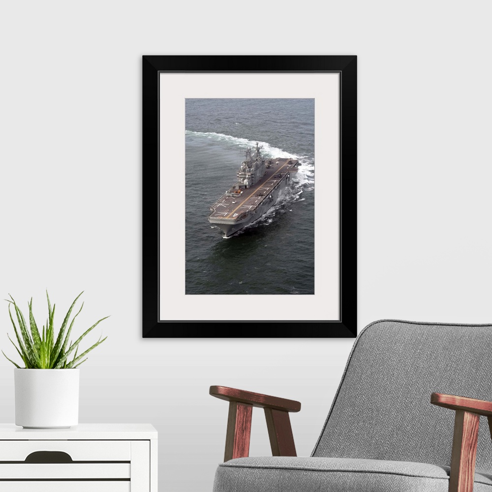 A modern room featuring The amphibious assault ship USS Nassau.