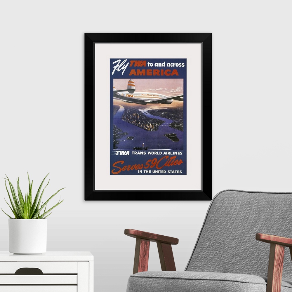 A modern room featuring A 1950s Trans-World Airlines poster showing a TWA Lockheed Constellation over Manhattan.