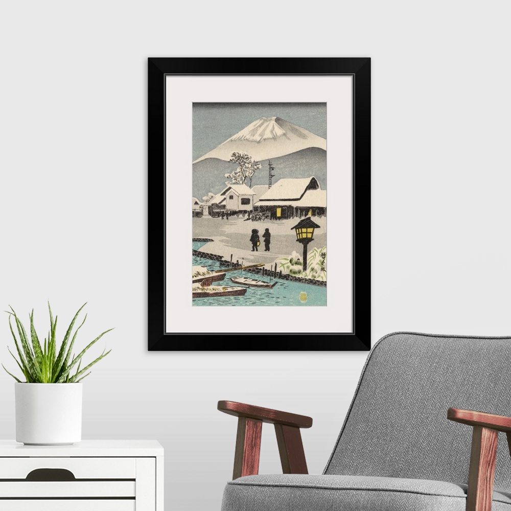 A modern room featuring Eastern art of snowy village scene with Mount Fuji in the background.
