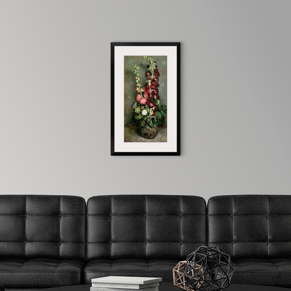 A modern room featuring Classic vertical floral art of a tall vase of Hollyhock flowers in bloom.