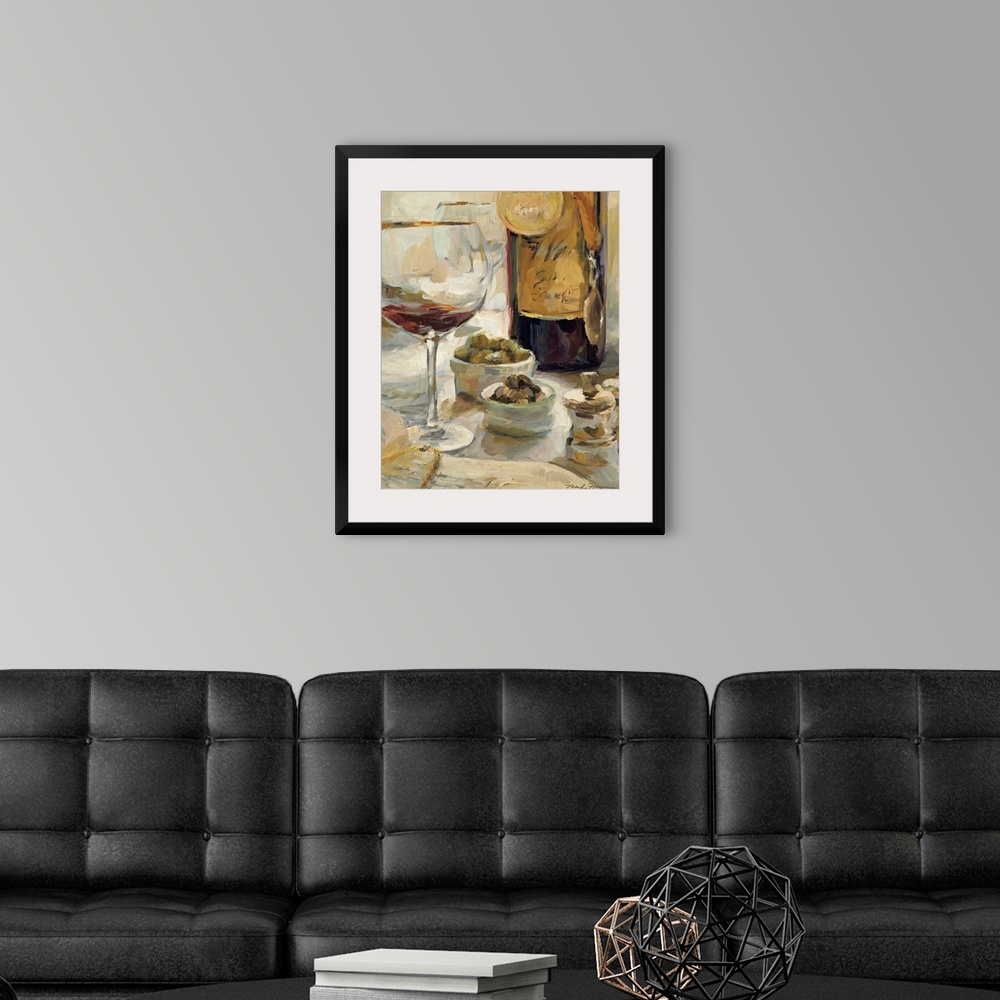 A modern room featuring Painting depicting a nearly empty glass of wine and a wine bottle with award medals hanging aroun...
