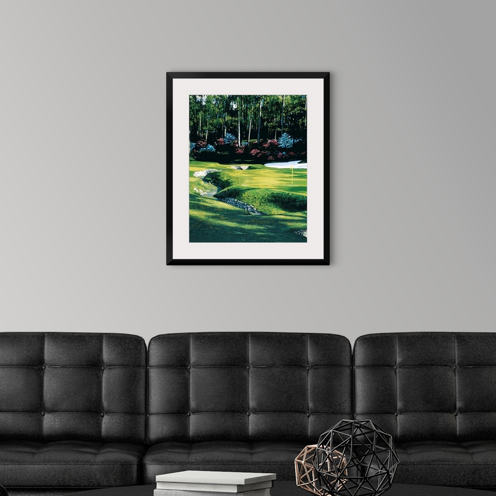 A modern room featuring Lifelike painting of stream crossing through a golf course, past the flag towards the forested ed...
