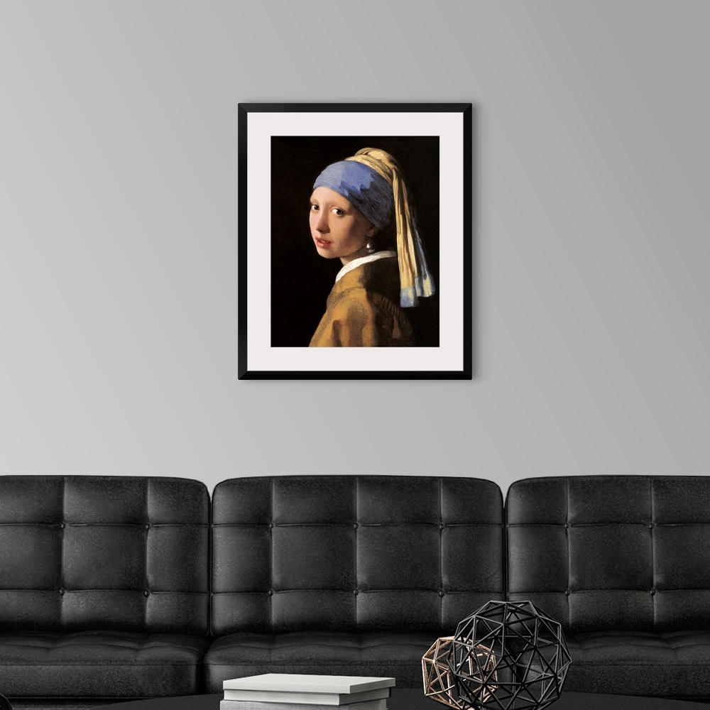 A modern room featuring Classic artwork of a girl that has her head slightly turned to the side so you can only see the l...
