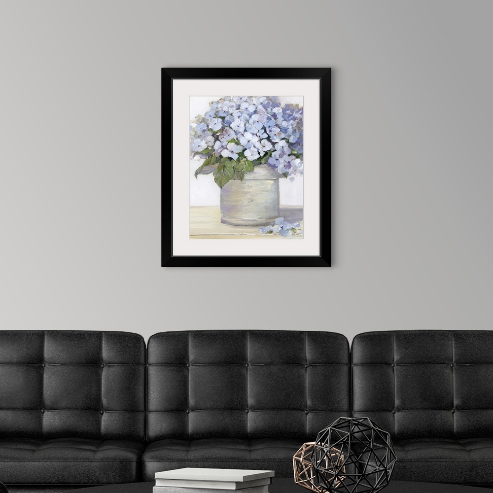 A modern room featuring Large still life painting of arranged lavender hydrangeas on a table.