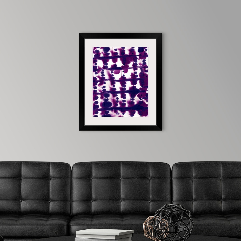 A modern room featuring A vertical abstract watercolor painting in deep purple.
