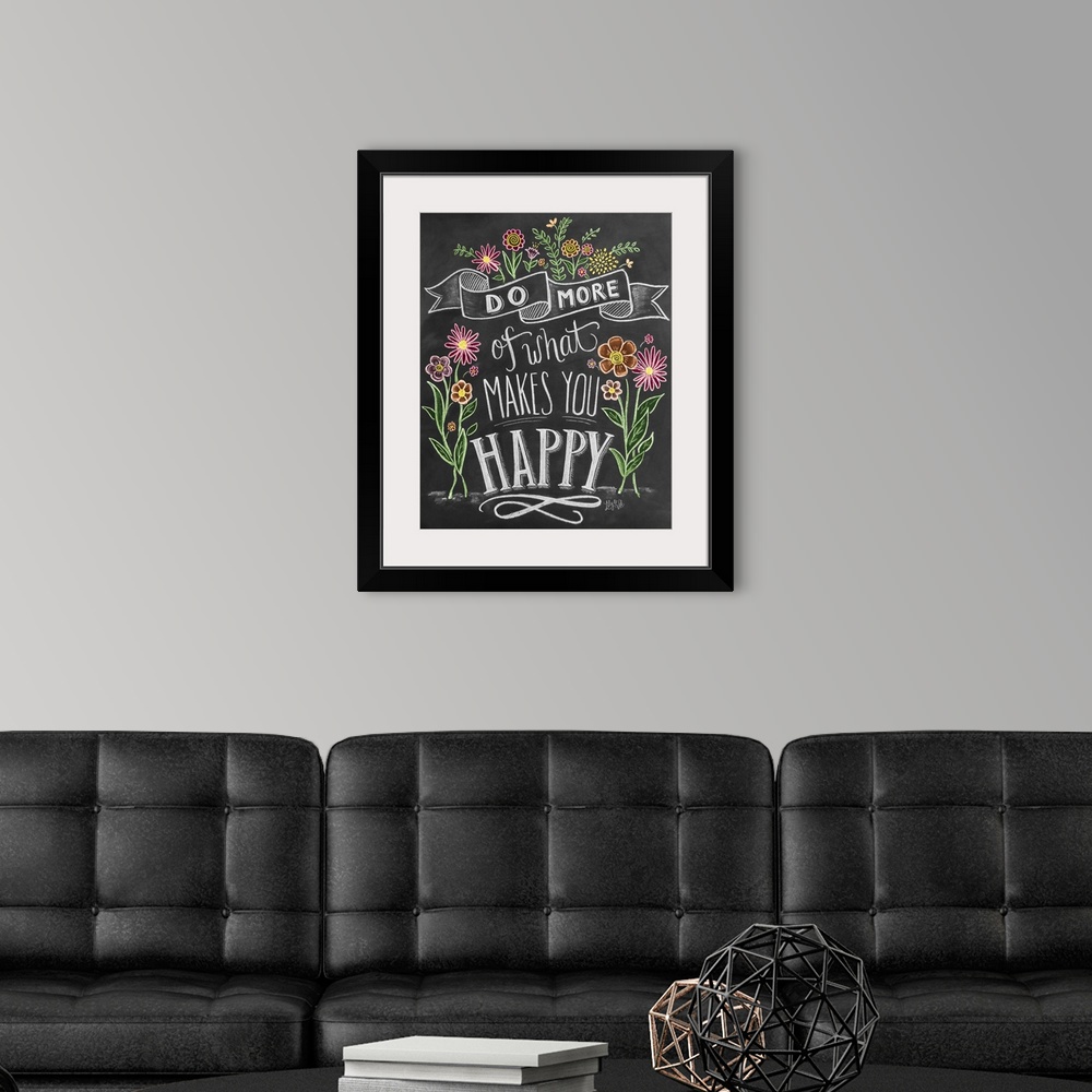 A modern room featuring "Do more of what makes you happy" handwritten and illustrated with flowers.