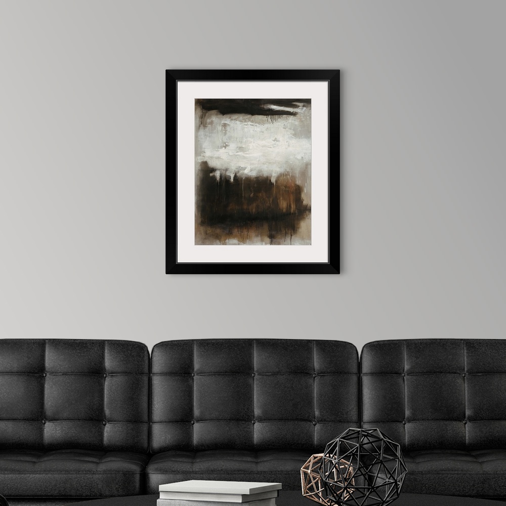 A modern room featuring Abstract painting of a dark rectangular mass interrupted at the top by a light cluster of white b...