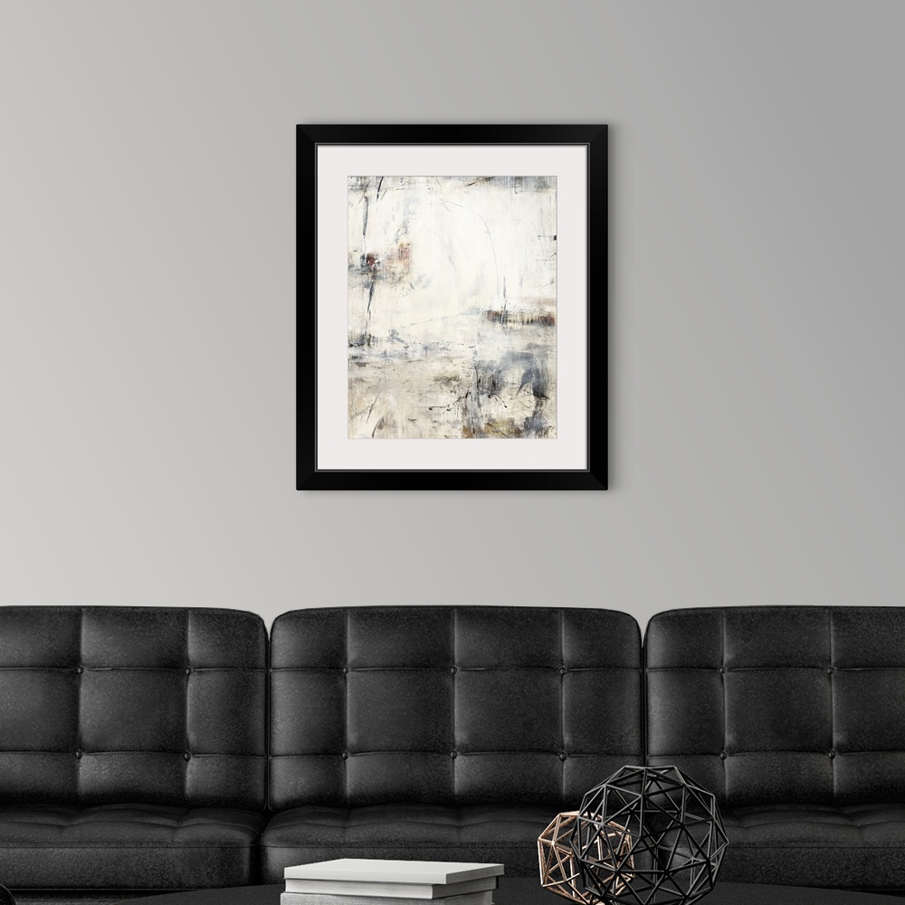 A modern room featuring A vertical painting of washed colors of gray and brown with dripped paint textures and swirled br...