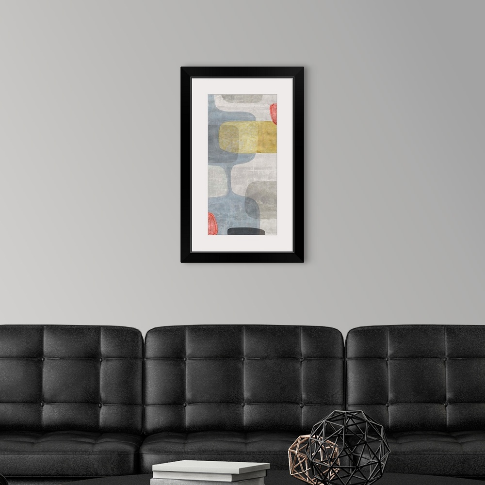 A modern room featuring Abstract panel painting with retro design in blue, gray, yellow, and red hues.