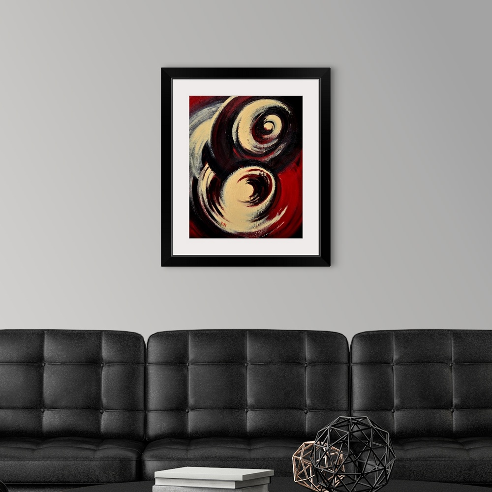 A modern room featuring A vertical abstract painting of two large swirls of color in beige, black and red.