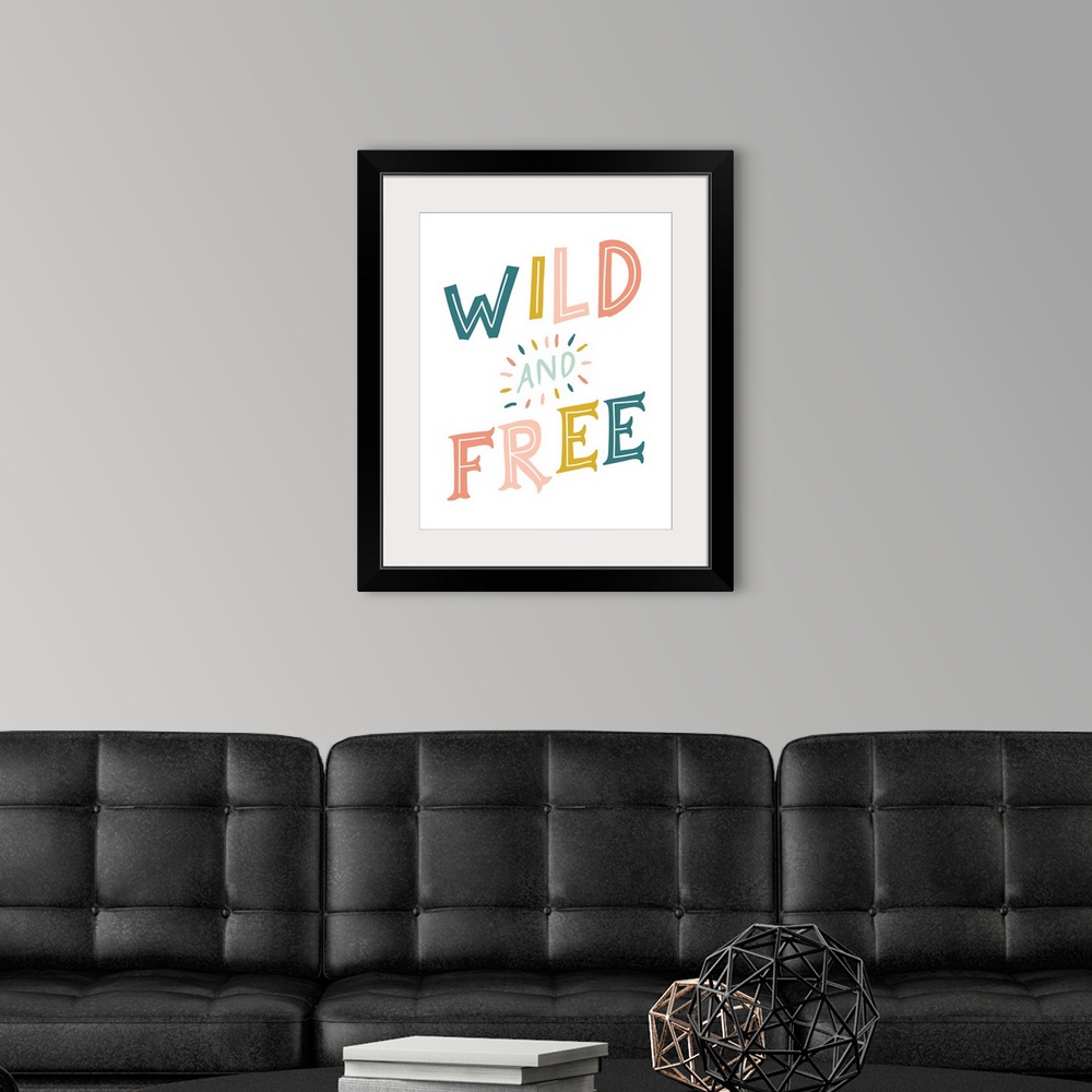 A modern room featuring Typography artwork with the words, "Wild and Free".