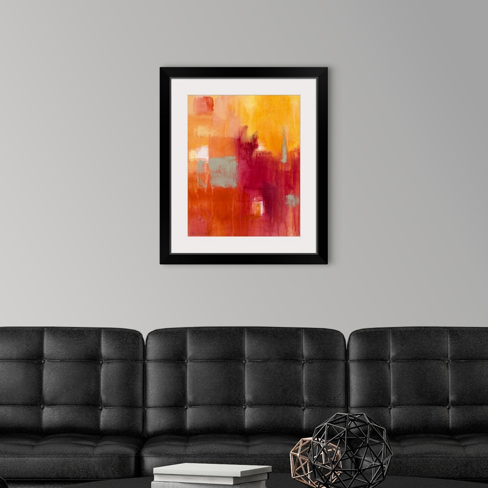 A modern room featuring Vertical, abstract painting on a big canvas of patches of transitioning colors in warm tones and ...