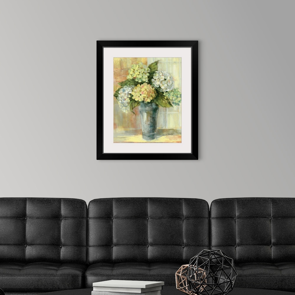A modern room featuring Portrait, large still life painting of golden hydrangeas in a vase, sitting on a counter if front...