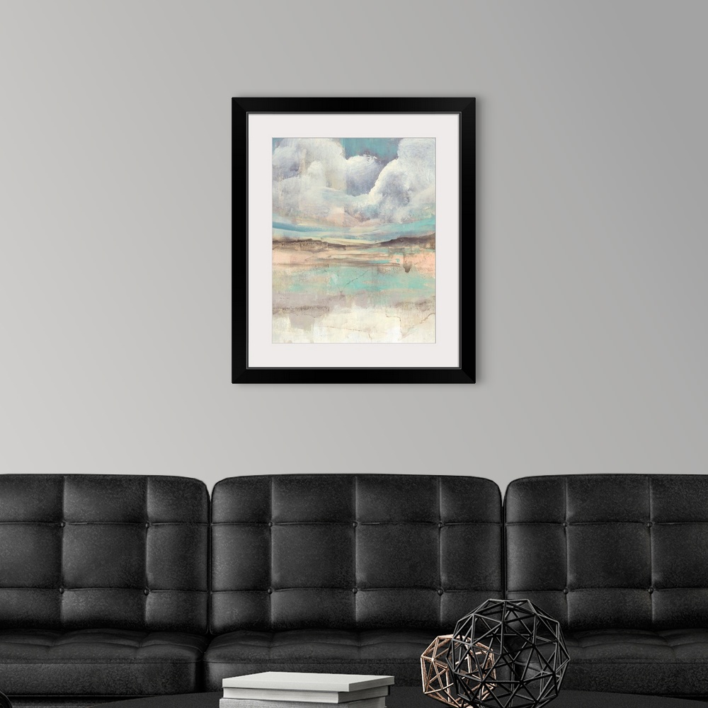 A modern room featuring Contemporary abstract with clouds hovering over a multi-colored landscape.