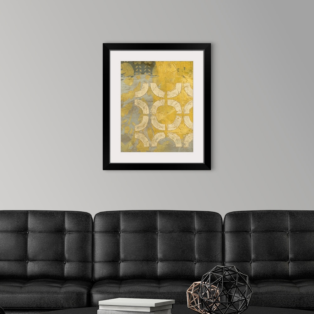 A modern room featuring Modern art with circular and other designs overlayed in a mix of neutral and bright tones.