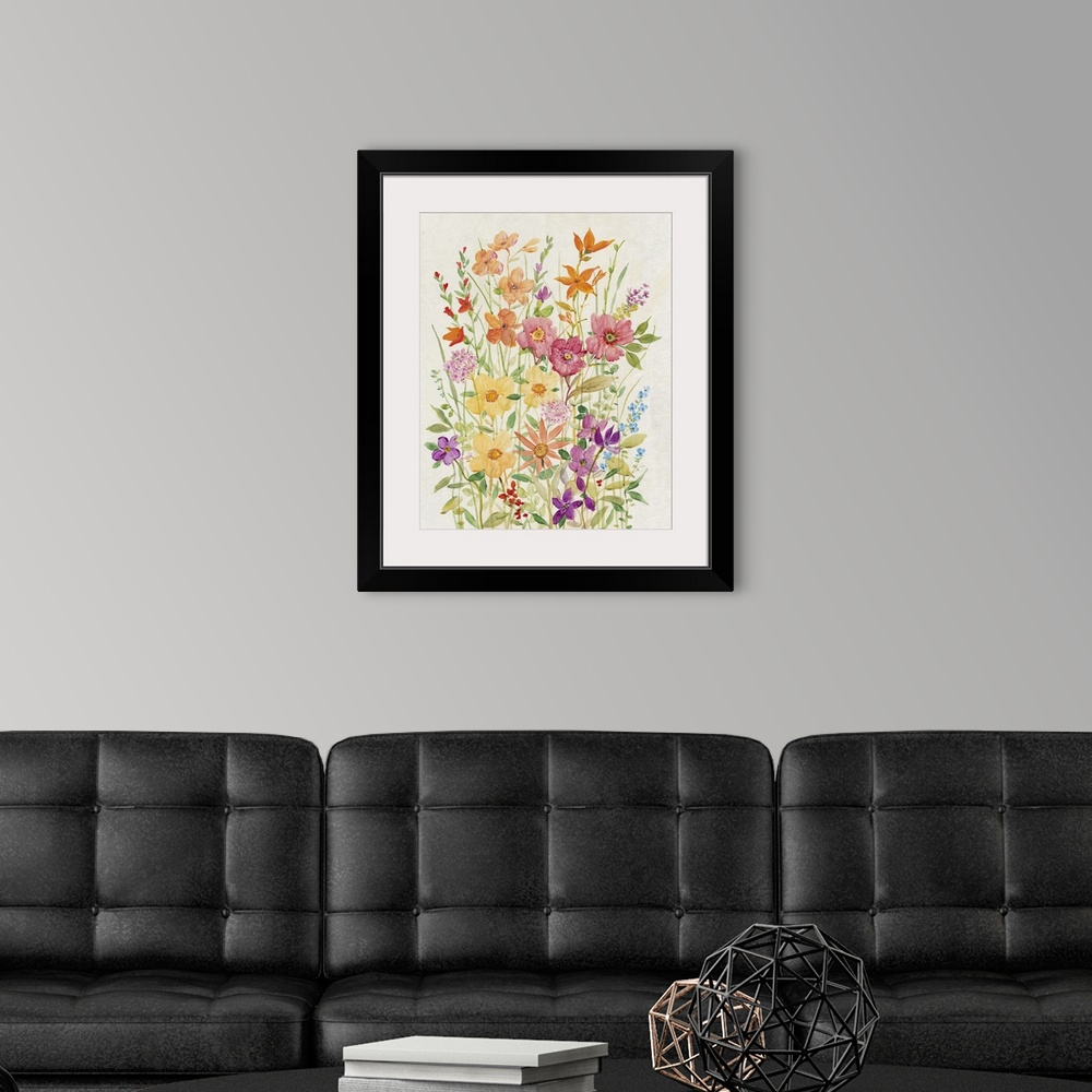 A modern room featuring A charming painting of  vibrant, warm colored wild flowers in a summer garden.