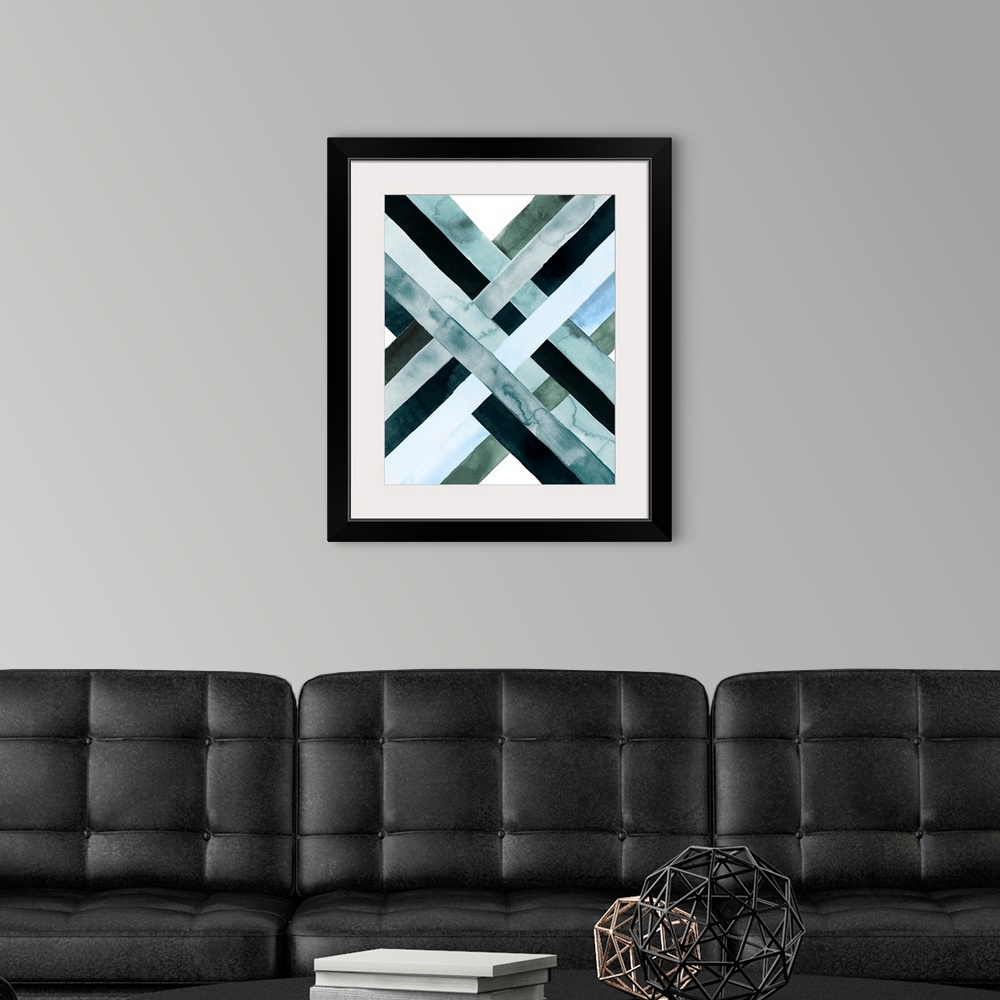 A modern room featuring Abstract watercolor artwork of woven bands in black and blue shades, forming an X shape.