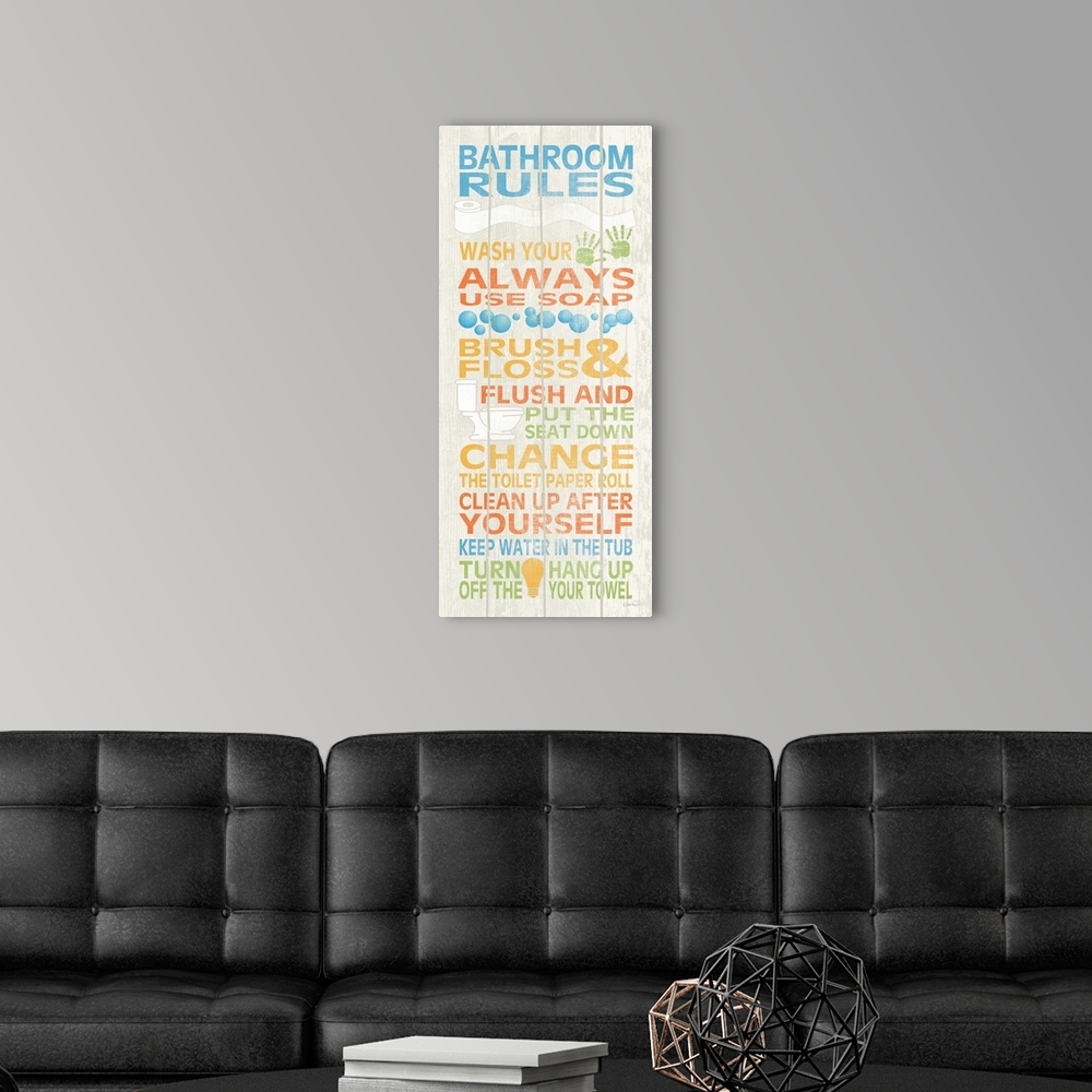 A modern room featuring A colorful list of bathroom rules on a tall wooden panel.