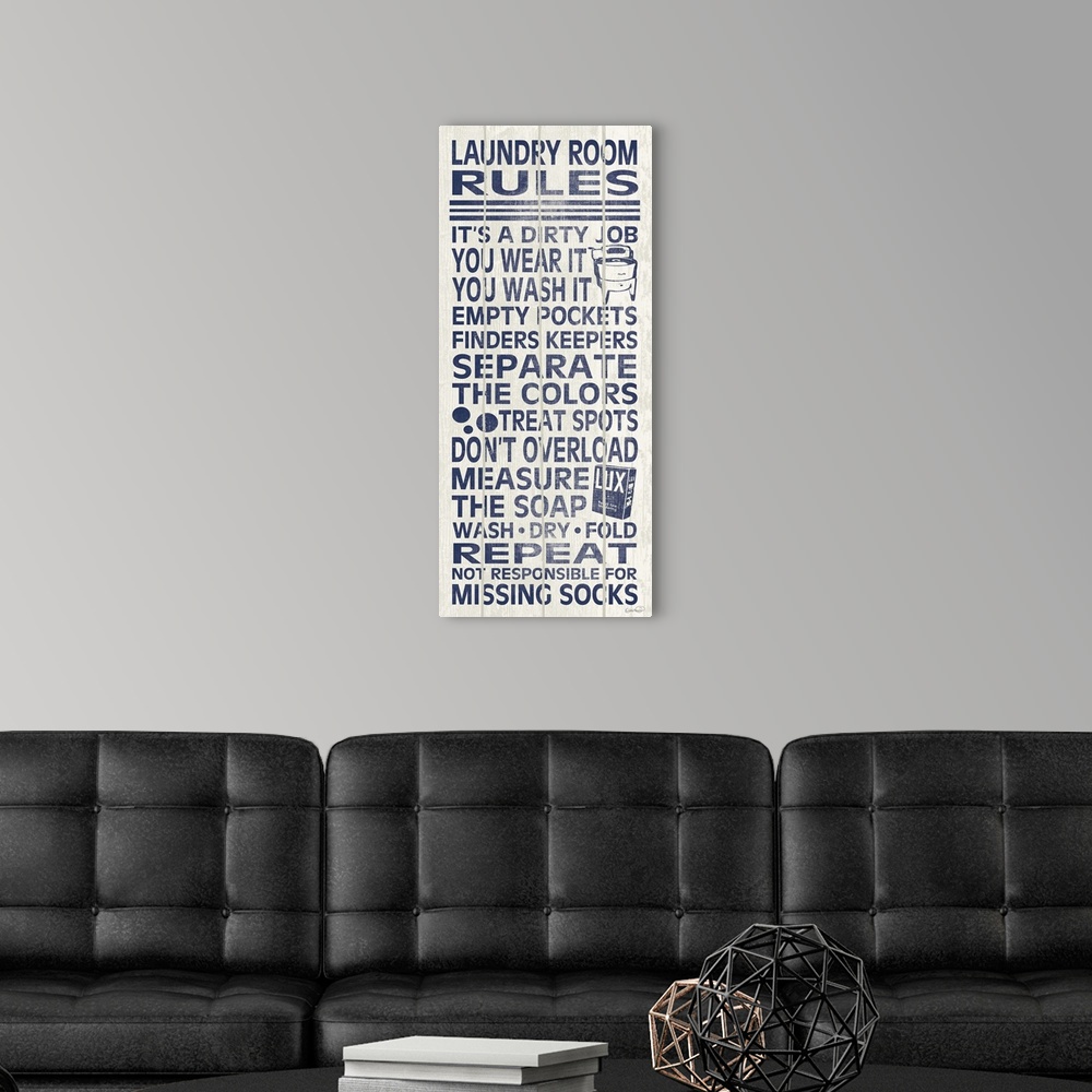 A modern room featuring Blue and white typography sign with a list of laundry room rules.