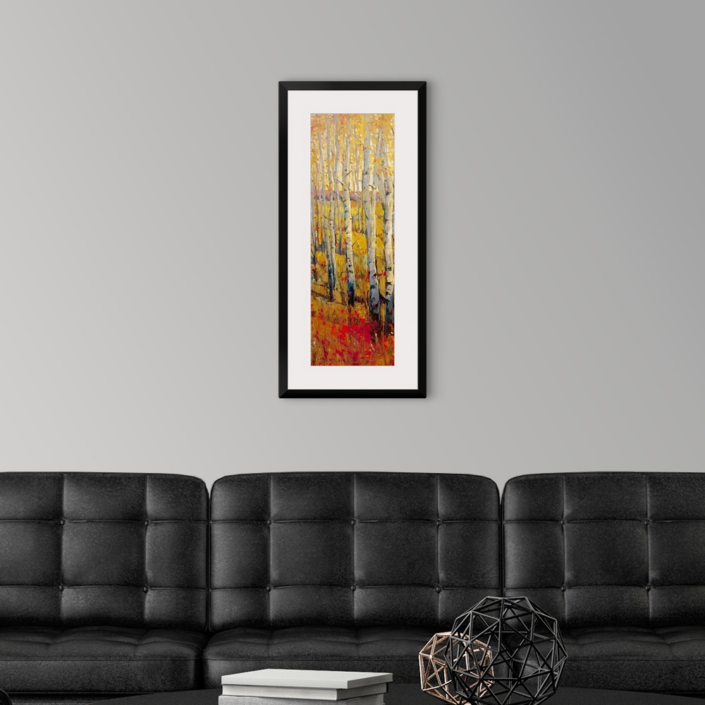 A modern room featuring This vertical painting of white barked trees in a narrow landscape of autumn colored grass.
