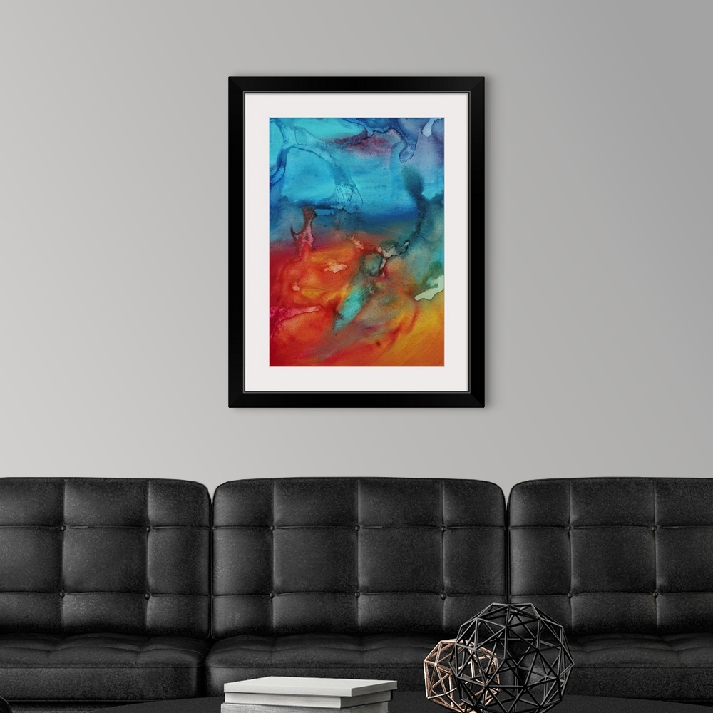 A modern room featuring Vertical abstract painting of cool colors merging into warm colors.