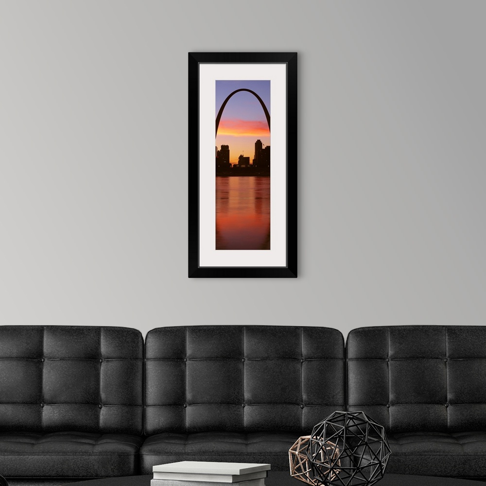A modern room featuring Vertical photograph on a big canvas of the Gateway Arch over St. Louis, Missouri, at sunrise.