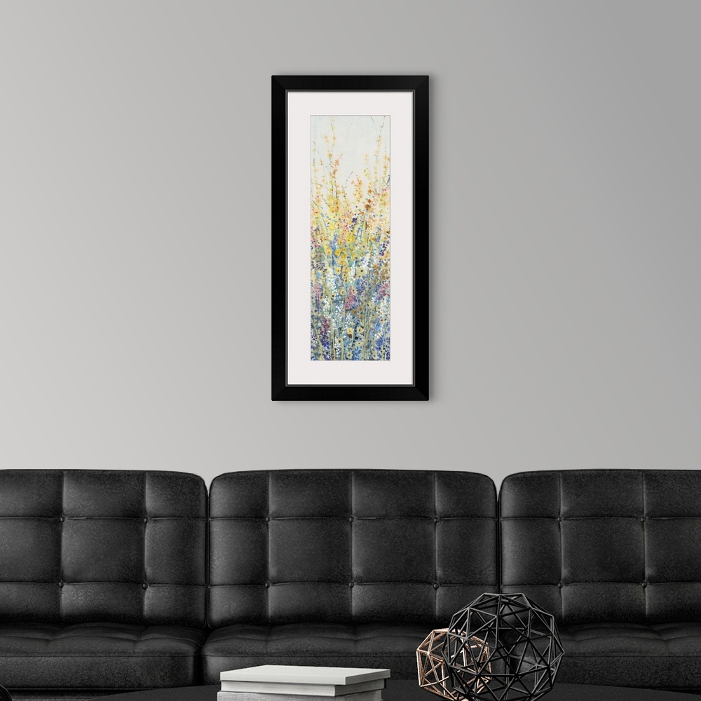 A modern room featuring Vertical panel of blooming yellow and blue wildflowers in a field.