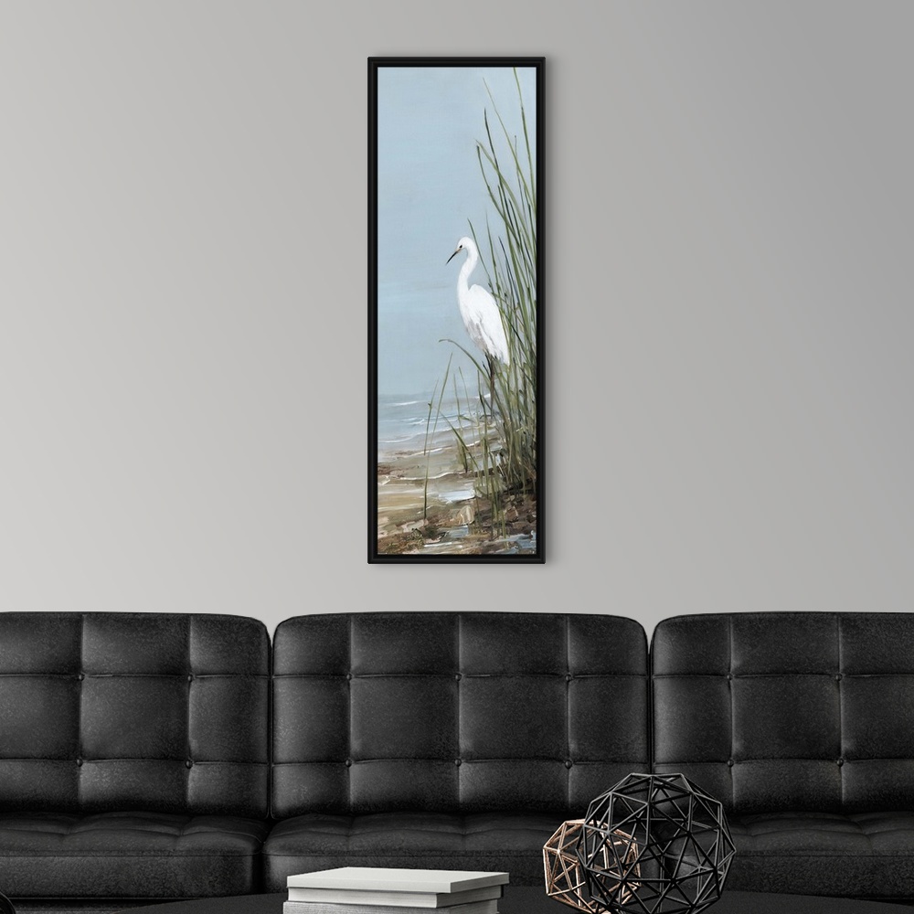 A modern room featuring Tall panel painting of an egret walking on the shore with tall beach grass.