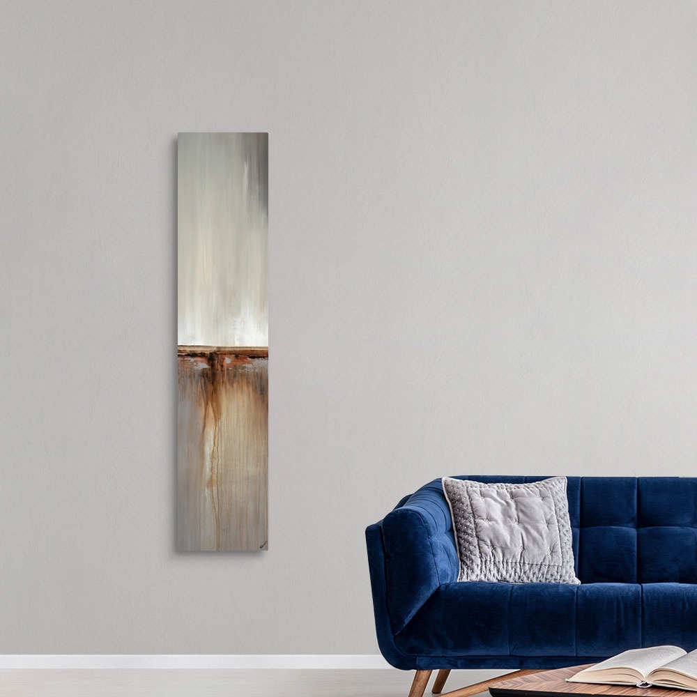 A modern room featuring Abstract painting with a composition of cool grays and tan divided in three sections.