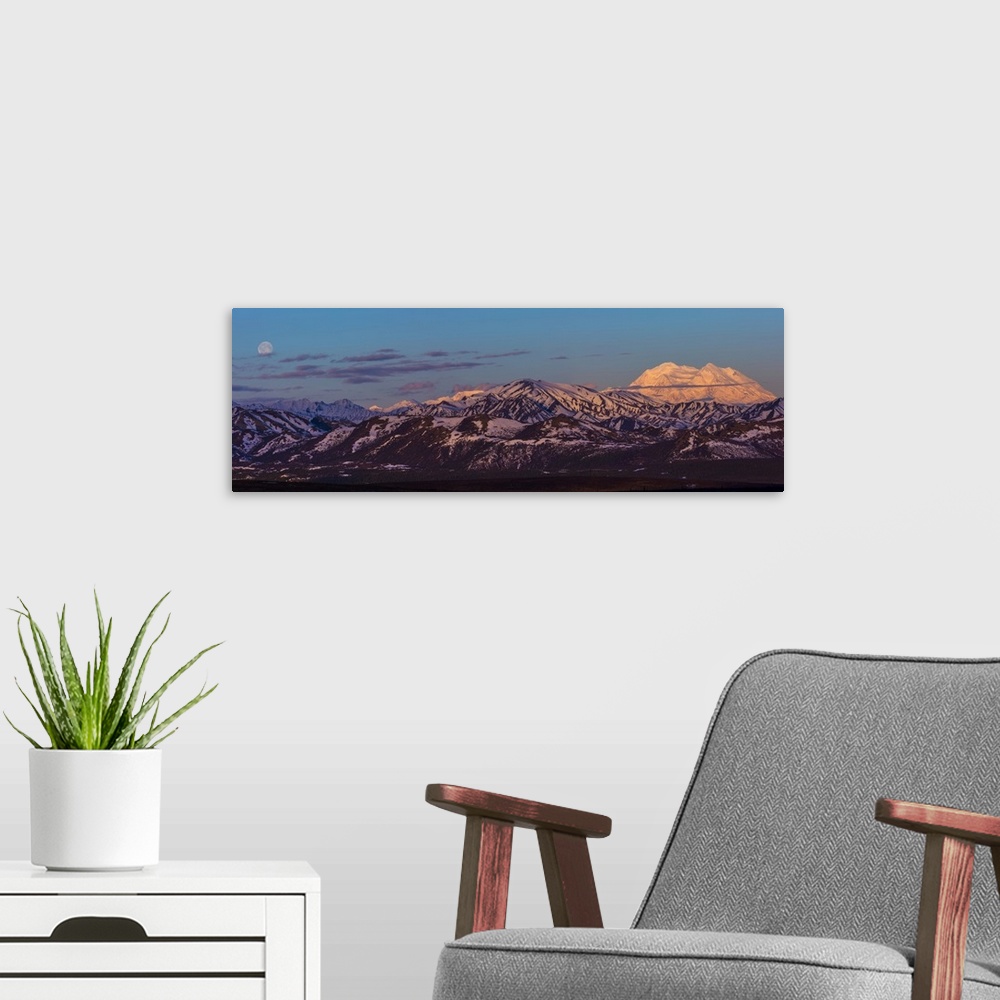 A modern room featuring Panoramic view of Denali at sunrise in early summer with a nearly full moon; Alaska, United State...