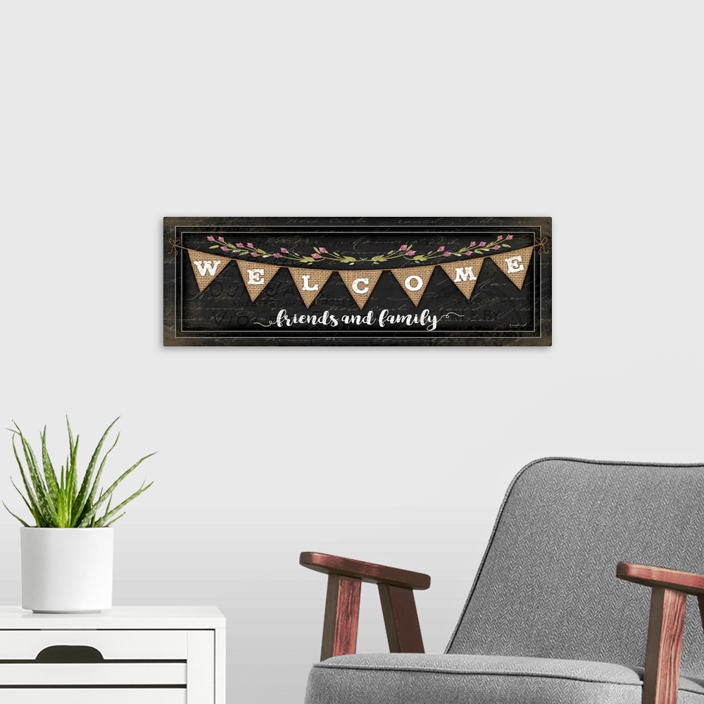 A modern room featuring "Welcome Friends and family" on a bunting banner with flowers.