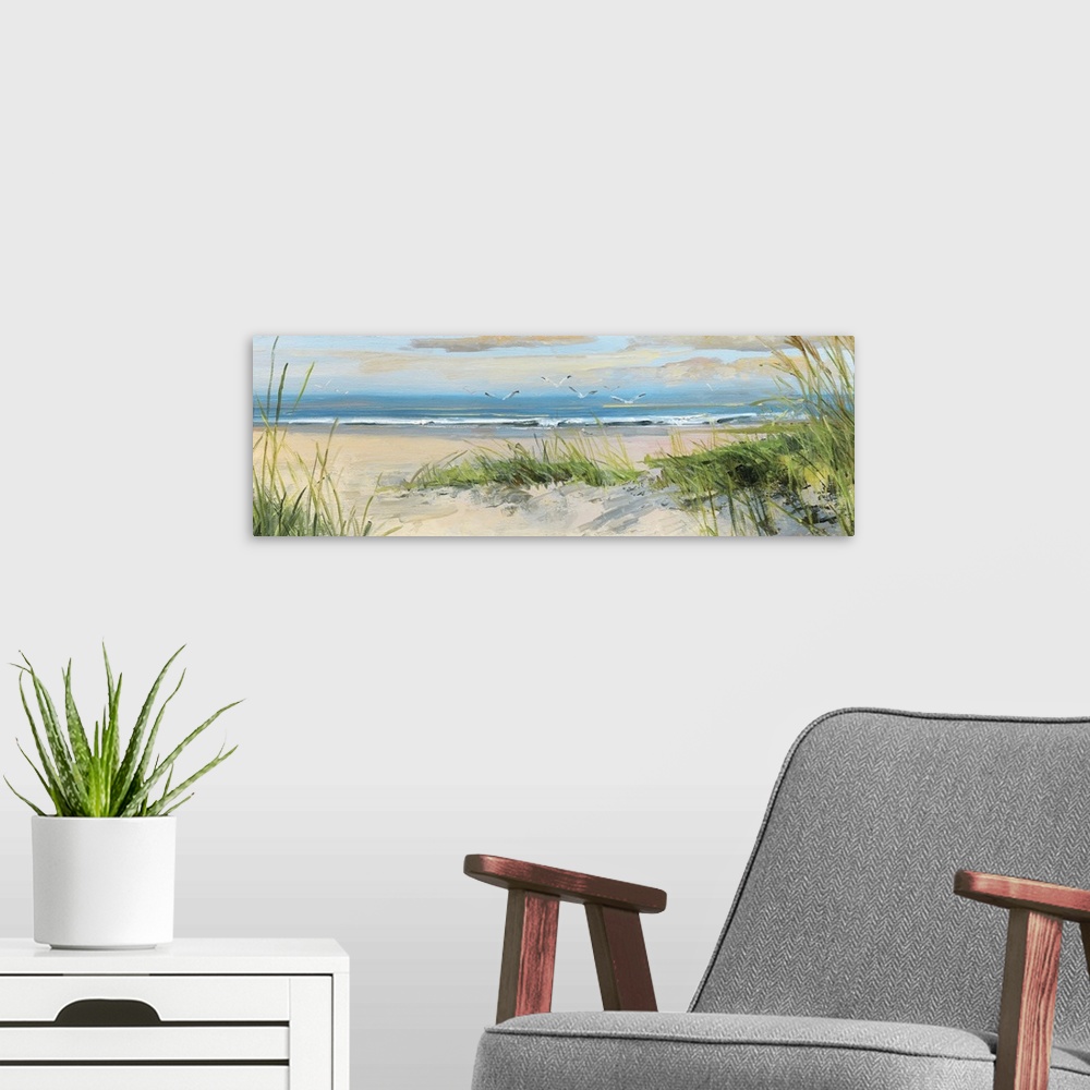A modern room featuring Contemporary landscape painting of grass on a sandy beach at the edge of the ocean.