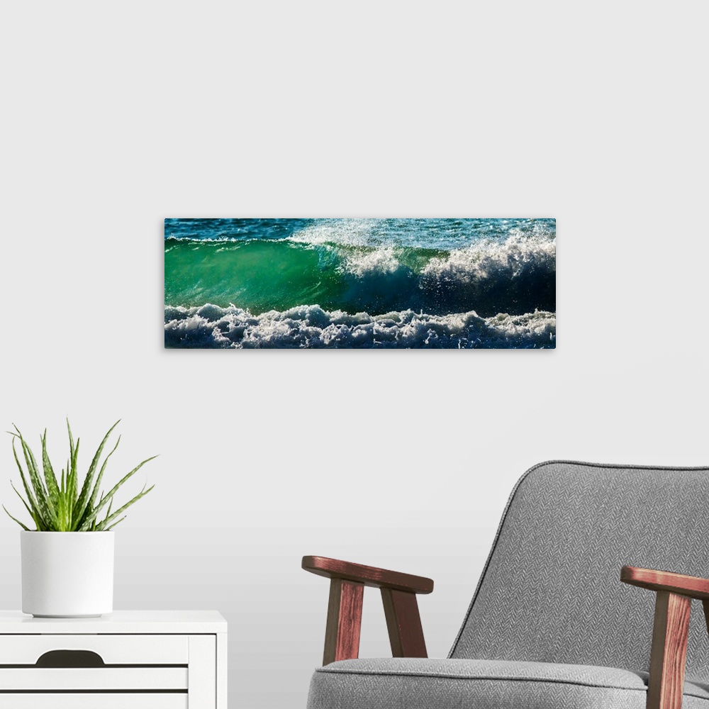 A modern room featuring Panoramic photograph of an ocean wave.